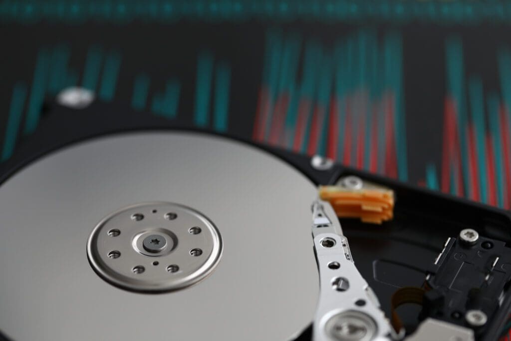 Hard disk is on table at repair service closeup. Information recovery and database concept.